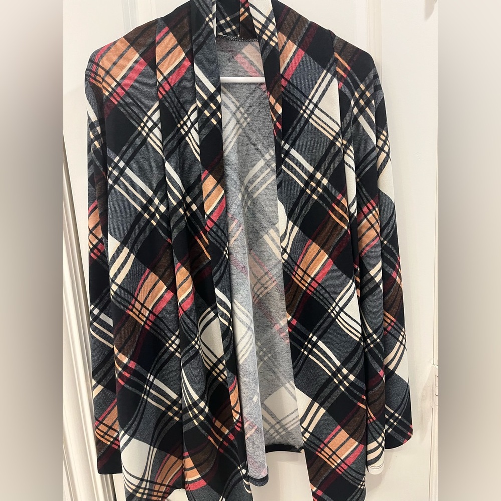 Plaid light weight cardigan with angled swing front bottom. Perfect for fall!